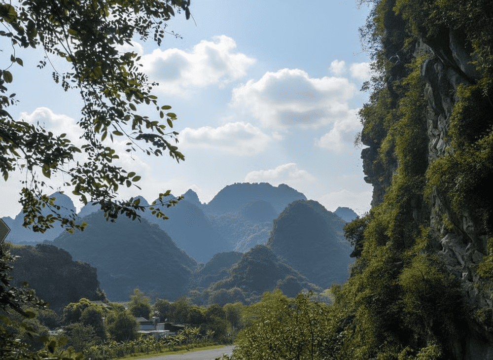 The sunset glows warmly from the mountaintop